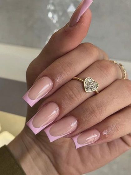 A classic square-shaped French manicure with a soft pink tip. This is a subtle and elegant choice for everyday wear.