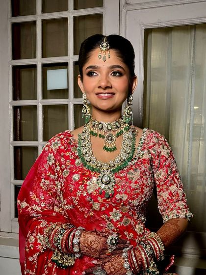 A beautiful portrait of a traditional bride. Her eyes are softly defined, and her skin has a natural, healthy glow.