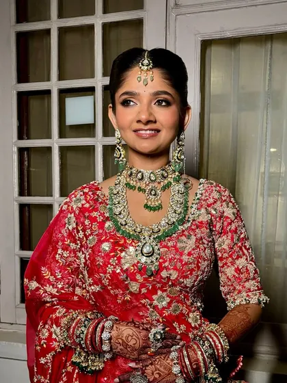 A beautiful portrait of a traditional bride. Her eyes are softly defined, and her skin has a natural, healthy glow.