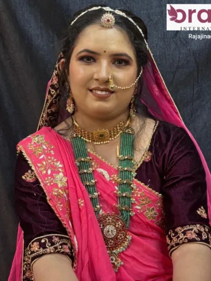 A full portrait of the royal Rajasthani bridal look, complete with a traditional dupatta and heavy jewelry.