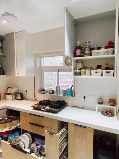 A glimpse into a beautifully organized kitchen we designed. The countertops are clear, and every drawer and cabinet has a purpose.