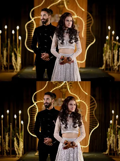 The couple posing on stage during their engagement ceremony in Orchha. The unique decor and warm lighting make for a memorable and artistic photograph.