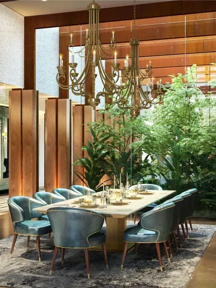 This is what home means to us. A space where life unfolds, where the boundaries between inside and out dissolve, and where every detail, from the grand chandelier to the lush courtyard view, comes together to create a seamless experience. We designed this dining area not just for meals, but for moments of connection with nature and family.