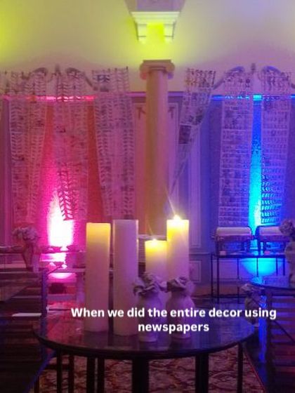 The final look of the newspaper decor at the Windsor halls. The recycled paper curtains, combined with dramatic lighting and candles, transformed the space completely.