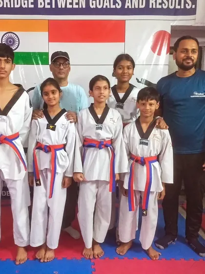 The red and blue belt group after their promotion test. These senior color belts are role models for the junior students.