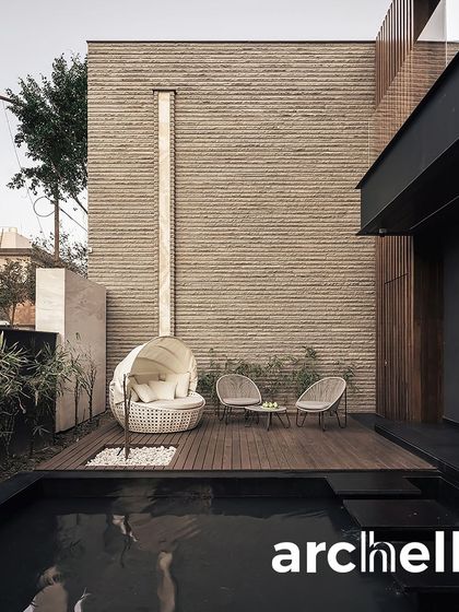 This private poolside deck from our Carbonado project offers a secluded spot for relaxation. The design uses natural materials like brick and wood to create a warm, tactile environment that feels both modern and timeless.