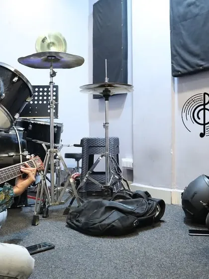 A picture that says it all. This is what our one-on-one coaching looks like: two musicians, sharing a moment, learning and growing together. It's more than a lesson; it's a jam session.