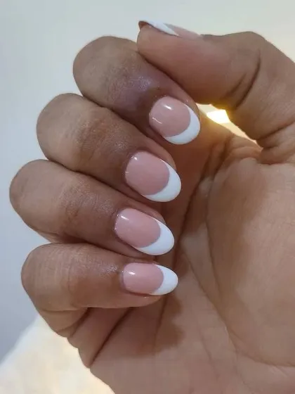 The clean lines and perfect curves of this classic French manicure on short, natural nails. This look is effortlessly chic and always in style.