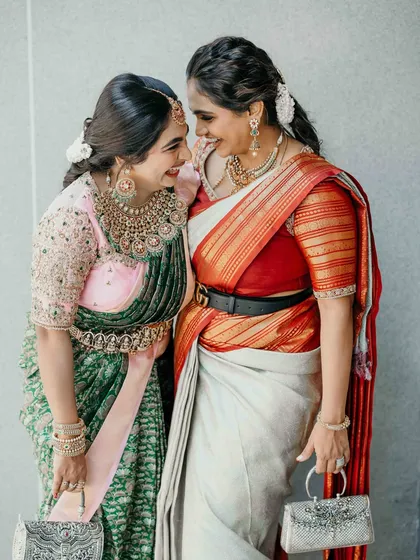 There is nothing more rewarding than seeing my creations become part of cherished family moments. Here, two sisters radiate joy, one in a custom-designed half-saree that blends tradition with a modern twist.