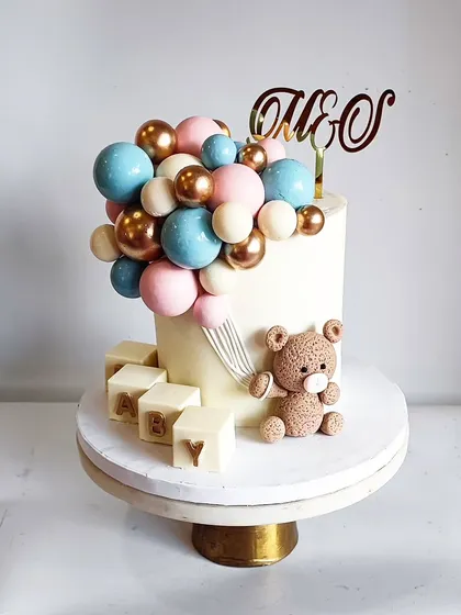 Another angle of the teddy bear baby shower cake. The pastel colors are perfect for a gender-neutral celebration.