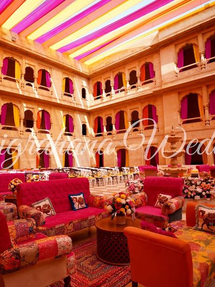 Another view of the palace courtyard Mehendi, showing the colorful seating arrangements and patchwork furniture that added to the Rajasthani vibe.