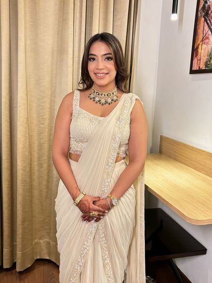 Soft glam for Pranjali's engagement. Her white saree was complemented by a dewy base and a subtle smokey eye.