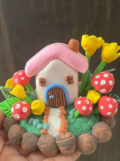 The beautiful final result of our online miniature clay house workshop. I provide step-by-step instructions to help students create pieces like this.