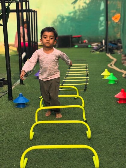 Starting them young. This three-year-old learns balance and coordination by carefully navigating the agility course at our Vikhroli park.