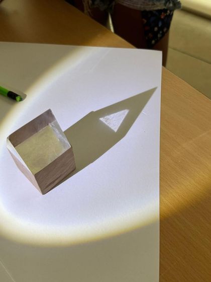 In our emergent literacy workshop, children explore light and shadow. By tracing the shadows of objects, they develop fine motor control and visual thinking, turning a science concept into a pre-writing and storytelling activity.