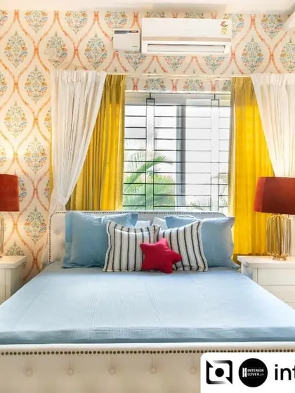 Color makes a kid's room come alive. This vibrant bedroom uses a playful mix of patterns and bright colors, from the geometric rug to the bold wallpaper and sunny yellow curtains, creating a cheerful and energetic space.