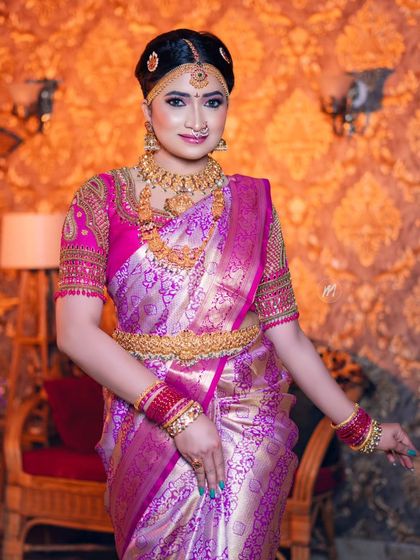 A full-length view of the Telugu muhurtham look, showing the beautiful drape of the saree and the complete jewellery set.