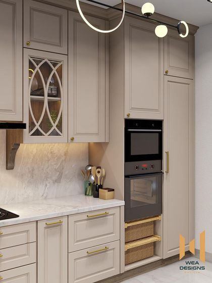 The tall unit in the neoclassical kitchen seamlessly integrates the oven and provides additional storage.