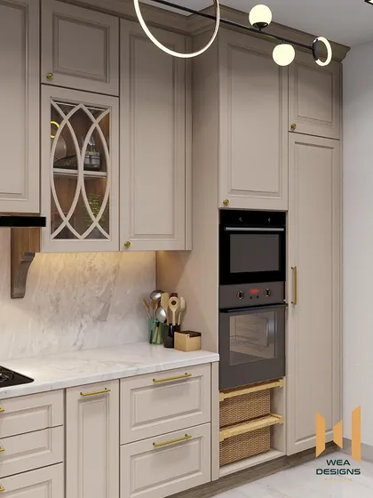 The tall unit in the neoclassical kitchen seamlessly integrates the oven and provides additional storage.