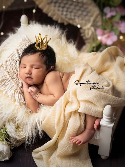 A duplicate of image 52, a testament to the beauty of capturing a newborn's fleeting smile.