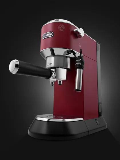 On weekdays, I shoot coffee machines. This is a classic hero shot of the red De'Longhi espresso machine against a dark background, making its bold color and metallic accents stand out dramatically.