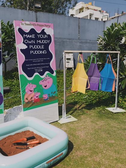 A "Make Your Own Muddy Puddle Pudding" activity station, a creative and interactive idea for the Peppa Pig theme.
