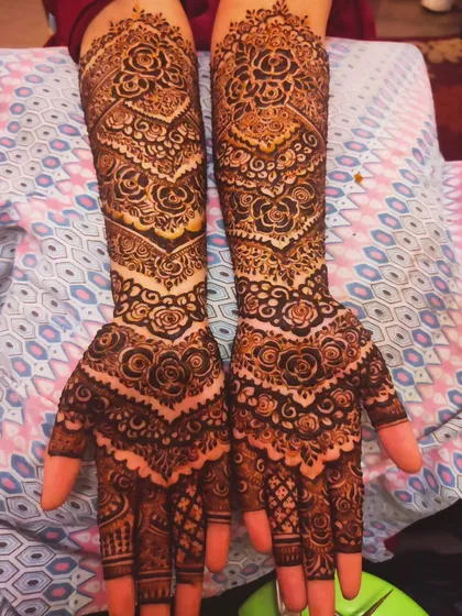 A unique bridal design featuring chevron patterns mixed with traditional roses, creating a modern yet classic look.