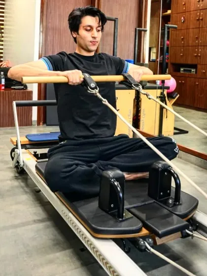 A client works on his upper body strength using the reformer. We believe in making movement a daily habit to build a stronger, more energized body.