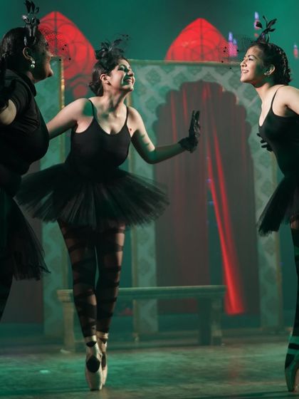 The evil princesses sharing a laugh on stage. Even the villains have fun in our productions.