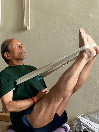 Navasana (Boat Pose) with a strap.