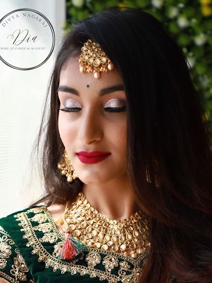 An elegant and modern bridal look featuring shimmering silver eyeshadow and a classic red lip. This style is perfect for a reception or sangeet, and I teach how to achieve this flawless, long-lasting finish.