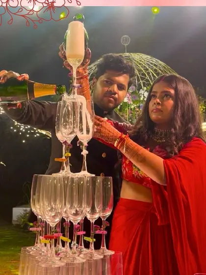 The classic champagne tower, a symbol of celebration. We love helping couples create this iconic moment at their reception, as seen here at Saltt, Karjat.