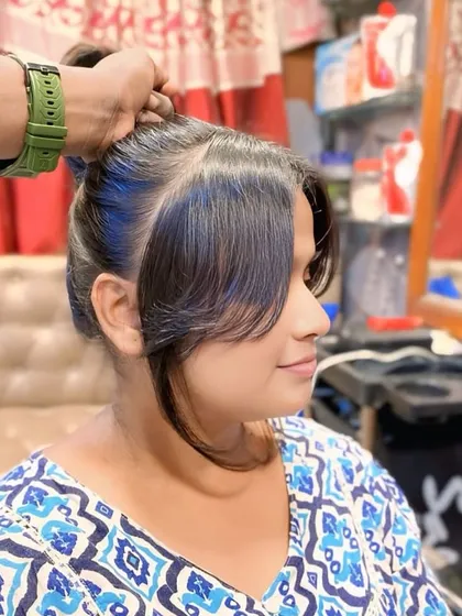Even a small change can make a big impact. Here, I added subtle blue streaks to the front bangs, giving a fun and creative touch to a classic tied-up hairstyle.