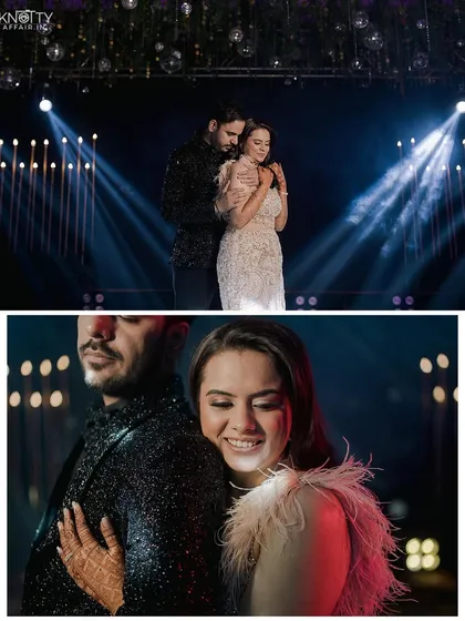 A glamorous couple portrait on the Sangeet stage with dramatic spotlights. We create stylish, high-energy shots that match the vibe of the event.