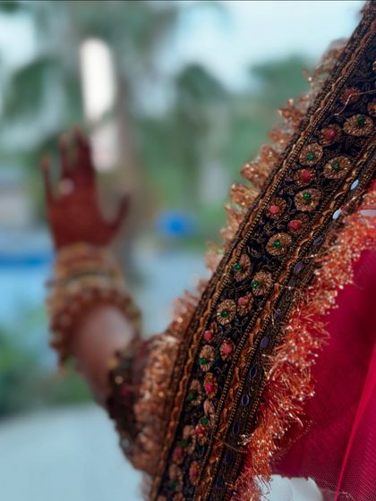 A close-up on the details. The intricate embroidery on the border of the dupatta is a work of art. It's these small elements that make a bridal outfit truly special.