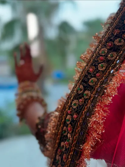 A close-up on the details. The intricate embroidery on the border of the dupatta is a work of art. It's these small elements that make a bridal outfit truly special.