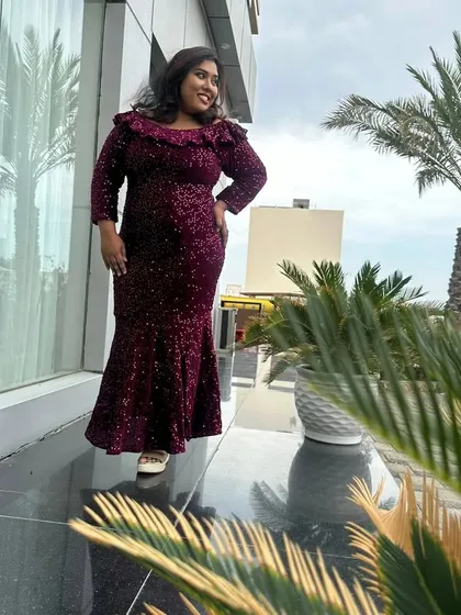 Posing against a backdrop of palm trees. I can bring a touch of glamour to events anywhere in the world.