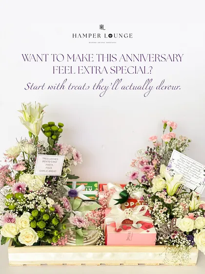 Want to make this anniversary feel extra special? Start with a hamper filled with treats they'll actually devour, surrounded by a lavish arrangement of fresh flowers. It's sweet, sentimental, and just the right amount of extra.