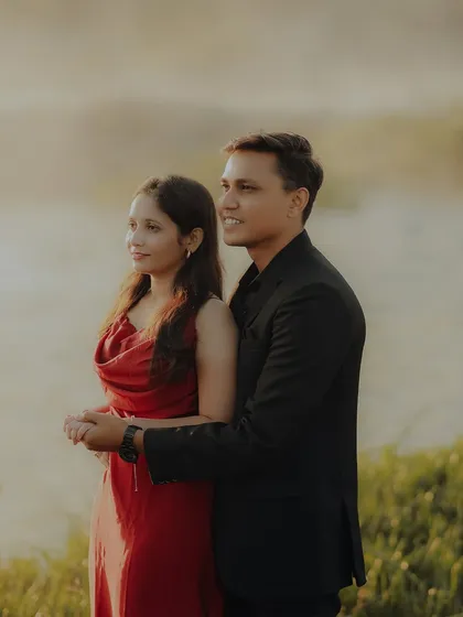 A candid portrait of the couple looking out at the view, united and content. The soft, hazy light adds to the romantic and dreamy feel of the pre-wedding shoot.