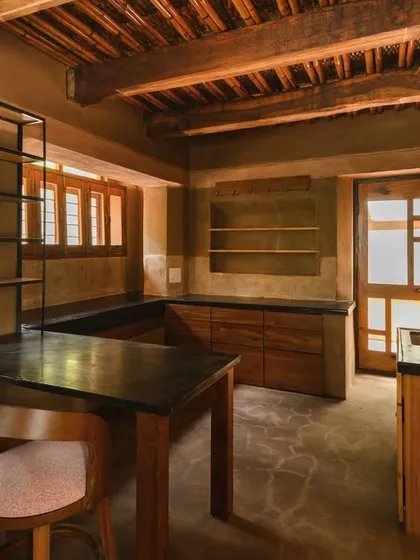 The kitchen is often the heart of a home, and this one was a joy to photograph. I focused on the interplay between the dark countertops, the warm wooden cabinetry, and the soft light from the windows. It’s a space that feels both functional and deeply inviting.