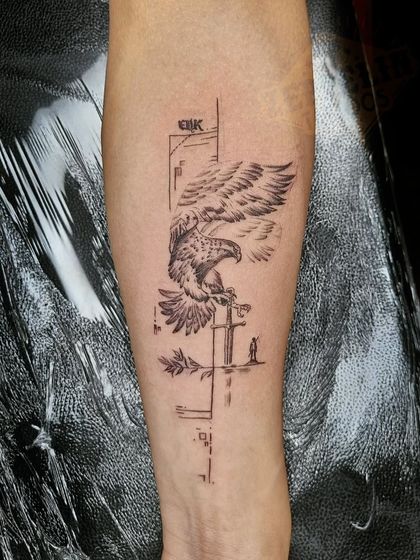 An eagle perched on an arrow, combined with abstract geometric lines. This tattoo symbolizes freedom, focus, and hitting one's mark.