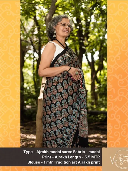 A graceful portrait of a customer wearing one of our classic black and red Ajrakh modal sarees. The timeless appeal of these handblock prints is perfect for women of all ages.
