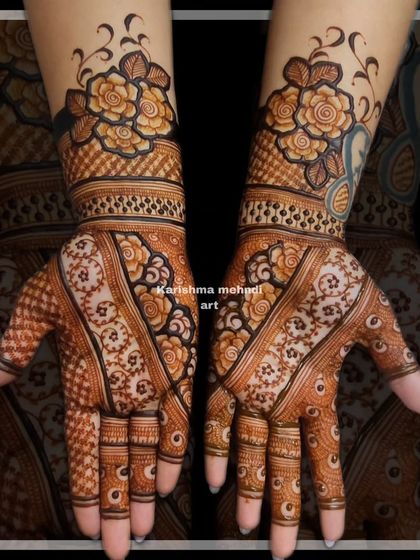 This design combines bold floral cuffs on the wrists with more traditional patterns on the palms. The contrast between the styles creates a unique and eye-catching look.