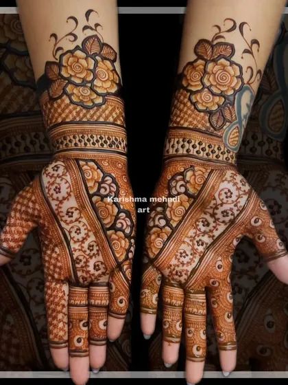 This design combines bold floral cuffs on the wrists with more traditional patterns on the palms. The contrast between the styles creates a unique and eye-catching look.