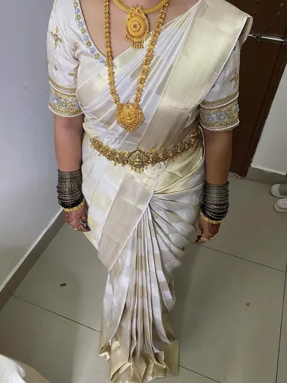The beauty of a Kanjivaram saree is in its pleats. Here, I've focused on creating clean, sharp, and perfectly aligned pleats that give the saree a graceful fall and ensure it stays immaculate throughout the day's events.