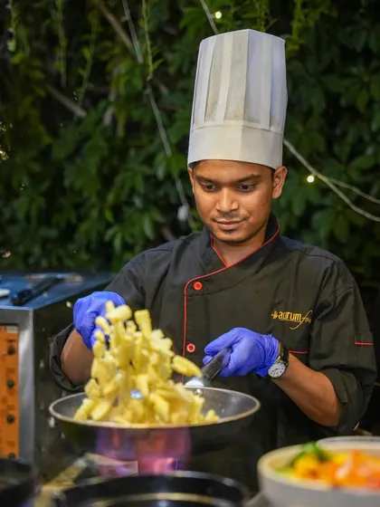 The energy of a live cooking station is infectious. Our chefs don't just cook; they perform, engaging with guests and preparing fresh, hot food right before their eyes, adding a dynamic element to any event.