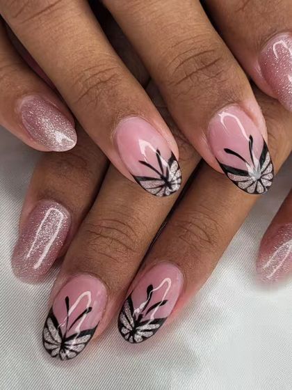 A classic butterfly wing design. The black line art over a sparkling pink base creates a beautiful contrast, perfect for a touch of elegant whimsy.