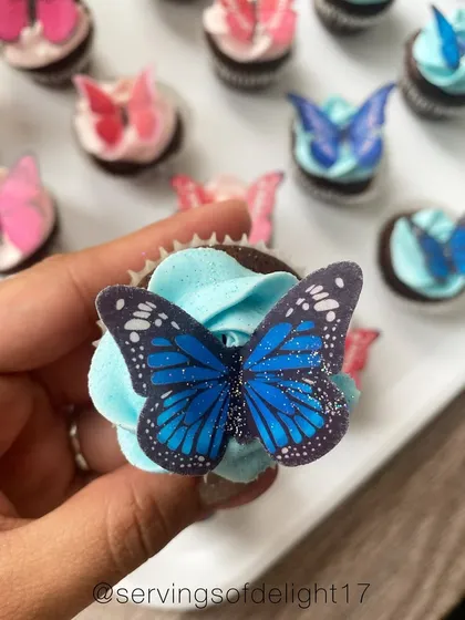 How pretty are these butterfly cupcakes? This is a chocolate cupcake with vanilla buttercream, topped with a delicate, edible wafer paper butterfly.