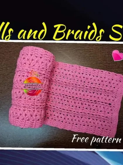 Announcing my very own 'Shells and Braids' scarf pattern. This pink scarf features a unique textured design combining shell stitches and braided columns.