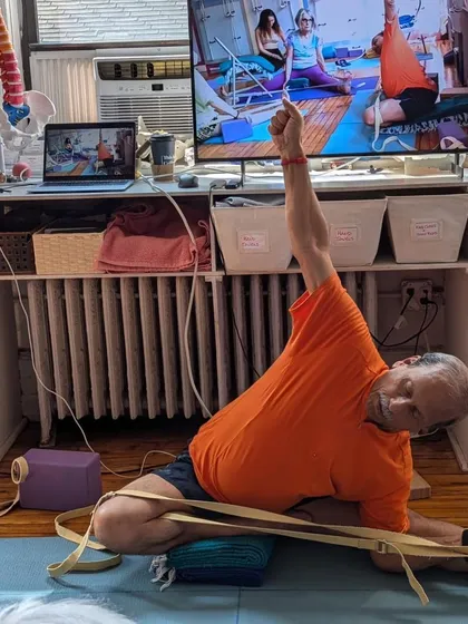 Another angle of a seated forward bend.